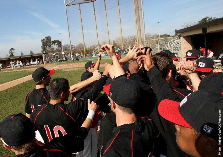 Image of CSUEB baseball players in a dug out.